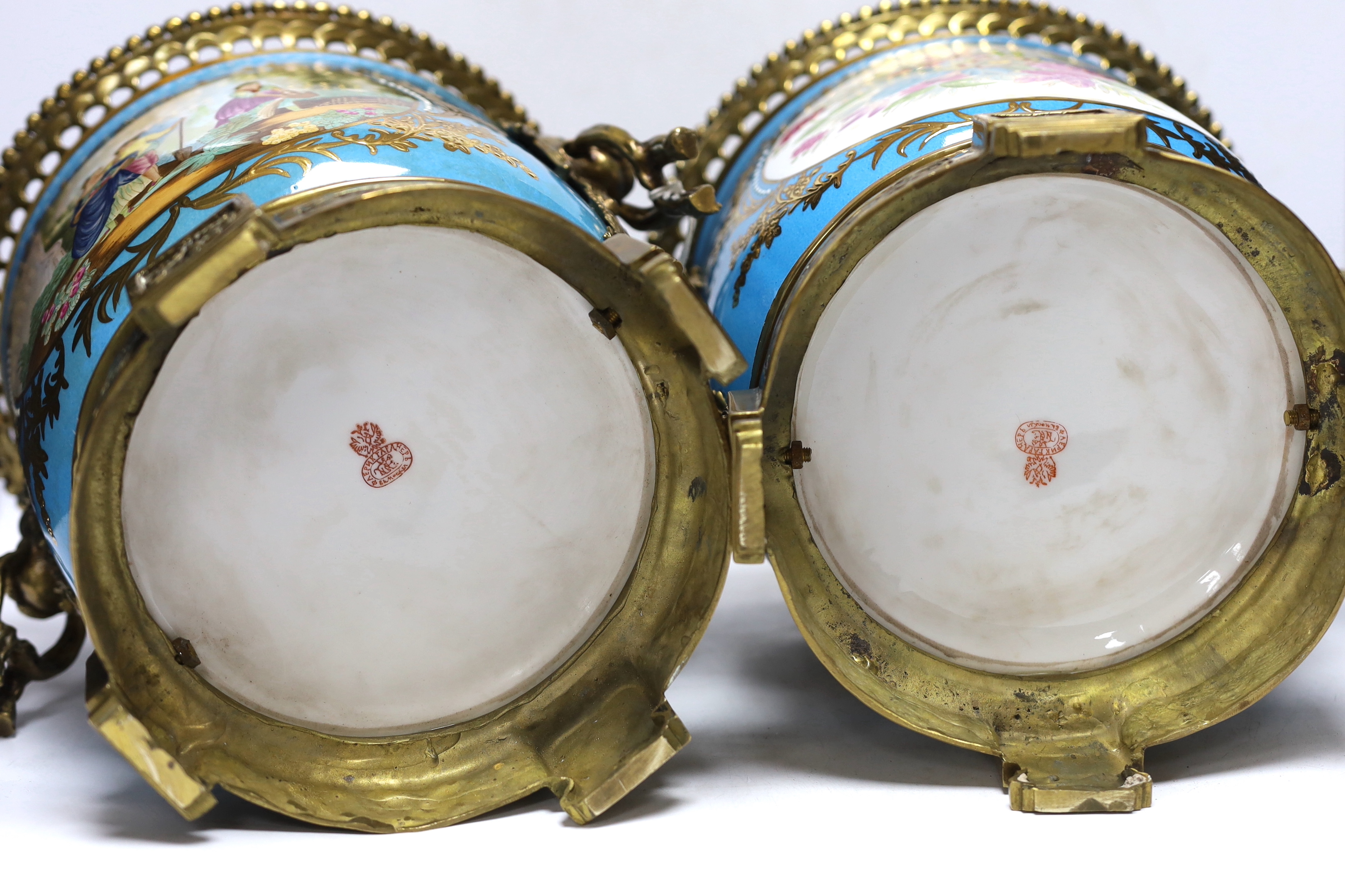 A pair of brass mounted Kusnetzoff style jardinières hand painted with figures, 28cm high